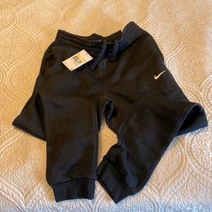 Nike sweatpants. Men’s S, fit like women’s M. Black joggers. New with tags.